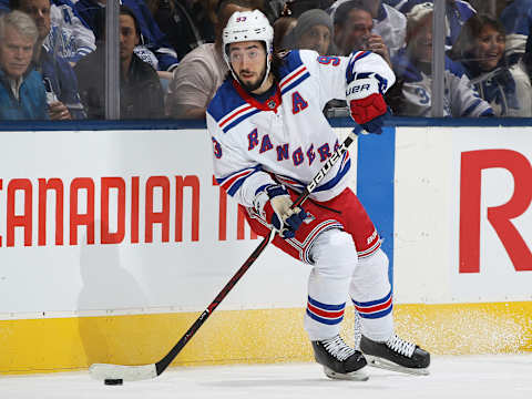 TORONTO, ON – DECEMBER 22: Mika Zibanejad #93 of the New York Rangers skates with the puck against the Toronto Maple Leafs during an NHL game at Scotiabank Arena on December 22, 2018 in Toronto, Ontario, Canada. The Maple Leafs defeated the Rangers 5-3. (Photo by Claus Andersen/Getty Images)