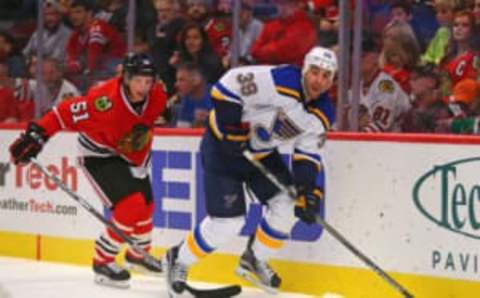 Oct 1, 2016; Chicago, IL, USA; St. Louis Blues forward Eric Nystrom (39) skates past Chicago Blackhawks defenseman Brian Campbell (51) during the third period of a preseason hockey game at the United Center. Chicago won 4-0. Mandatory Credit: Dennis Wierzbicki-USA TODAY Sports