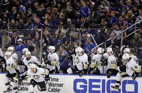 Mar 27, 2016; New York, NY, USA; The Pittsburgh Penguins bench celebrates after Penguins center Sidney Crosby (not pictured) scored the game winning goal against the New York Rangers in overtime at Madison Square Garden. The Penguins defeated the Rangers 3-2 in overtime. Mandatory Credit: Adam Hunger-USA TODAY Sports