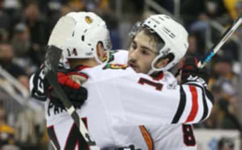 Chicago Blackhawks left wing Richard Panik (14) celebrates with center Nick Schmaltz (8) (Charles LeClaire-USA TODAY Sports)