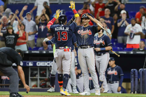 May 3, 2023; Miami, Florida, USA; Atlanta Braves right fielder Ronald Acuna Jr. (13) celebrates at home plate with left fielder Kevin Pillar (17) after hitting a three-run home run during the fifth inning against the Miami Marlins at loanDepot Park. Mandatory Credit: Sam Navarro-USA TODAY Sports