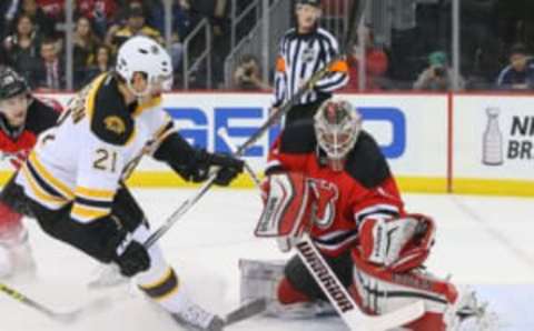 Mar 29, 2016; Newark, NJ, USA; New Jersey Devils goalie Keith Kinkaid (1) makes a save on Boston Bruins left wing Loui Eriksson (21) during the first period at Prudential Center. Mandatory Credit: Ed Mulholland-USA TODAY Sports