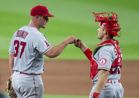 Dylan Bundi and Max Stassi of the Los Angeles Angels (Photo by Lindsey Wasson/Getty Images)