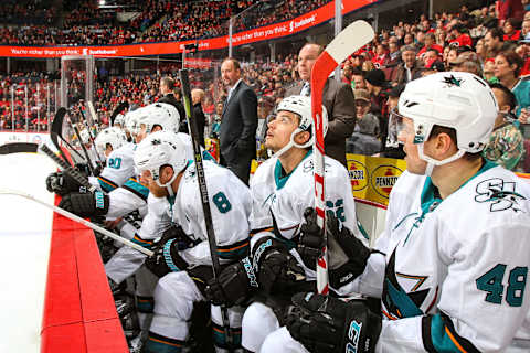 CALGARY, AB DECEMBER 14, 2017: Teammates of the San Jose Sharks sit on the bench in a game against the Calgary Flames at the Scotiabank Saddledome on Saturday night. (Photo by Brad Watson/NHLI via Getty Images)