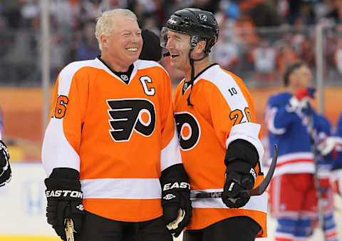 Bobby Clarke (left) and Dave Poulin (right) of the Philadelphia Flyers before playing against the New York Rangers in the NHL Winter Classic Alumni Game. (Photo by Jim McIsaac/Getty Images)