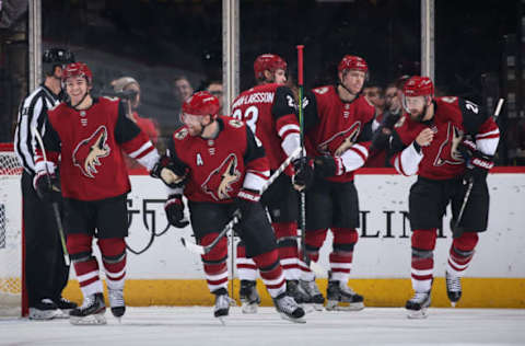 GLENDALE, ARIZONA – OCTOBER 17: (L-R) Clayton Keller #9, Phil Kessel #81, Oliver Ekman-Larsson #23, Christian Dvorak #18 and Derek Stepan #21 of the Arizona Coyotes celebrate after Kessel scored a power play goal against the Nashville Predators during the first period of the NHL game at Gila River Arena on October 17, 2019 in Glendale, Arizona. (Photo by Christian Petersen/Getty Images)