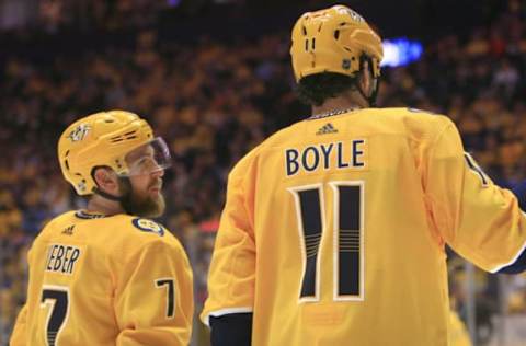 NASHVILLE, TN – MARCH 09: Nashville Predators defenseman Yannick Weber (7) and center Brian Boyle (11) talk during the NHL game between the Nashville Predators and Carolina Hurricanes, held on March 9, 2019, at Bridgestone Arena in Nashville, Tennessee. (Photo by Danny Murphy/Icon Sportswire via Getty Images)