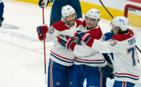 May 22, 2021; Toronto, Ontario, CAN; Montreal Canadiens center Jesperi Kotkaniemi (15) celebrates with right wing Joel Armia (40) after scoring a goal against the Toronto Maple Leafs during the first period in game two of the first round of the 2021 Stanley Cup Playoff at Scotiabank Arena. Mandatory Credit: Nick Turchiaro-USA TODAY Sports