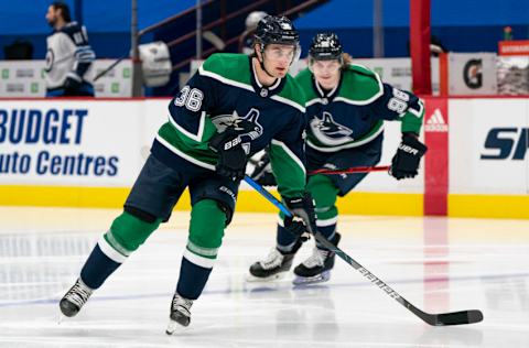 Vancouver Canucks, Nils Hoglander (36) and Adam Gaudette (96). (Photo by Rich Lam/Getty Images)