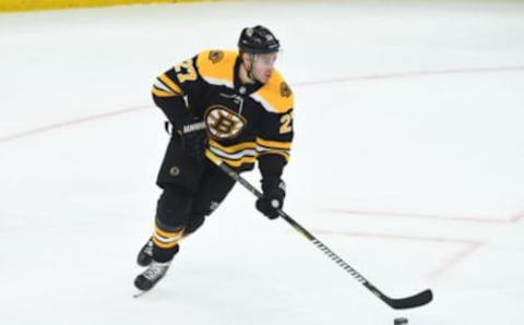 BOSTON, MA – APRIL 19: John Moore #27 of the Boston Bruins skates with the puck against the Toronto Maple Leafs in Game Five of the Eastern Conference First Round during the 2019 NHL Stanley Cup Playoffs at the TD Garden on April 19, 2019 in Boston, Massachusetts. (Photo by Steve Babineau/NHLI via Getty Images)