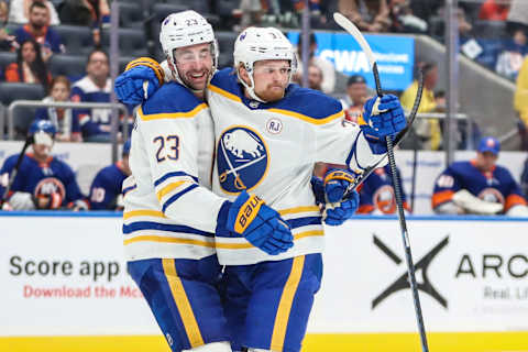 Oct 14, 2023; Elmont, New York, USA; Buffalo Sabres center Casey Mittelstadt (37) celebrates with defenseman Mattias Samuelsson (23) after scoring a goal in the third period at UBS Arena. Mandatory Credit: Wendell Cruz-USA TODAY Sports