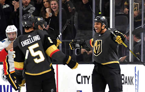 LAS VEGAS, NEVADA – OCTOBER 12: Ryan Reaves #75 of the Vegas Golden Knights celebrates with teammates after scoring a third-period goal against the Calgary Flames during their game at T-Mobile Arena on October 12, 2019 in Las Vegas, Nevada. The Golden Knights defeated the Flames 6-2. (Photo by Ethan Miller/Getty Images)