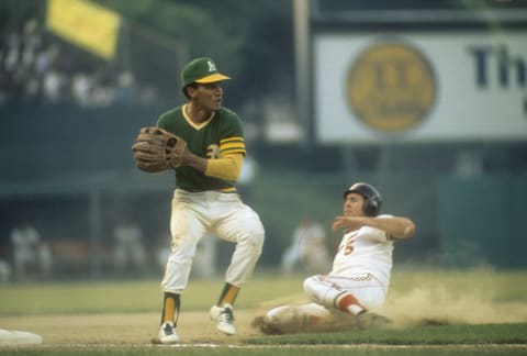 BALTIMORE, MD – CIRCA 1972: Bert Campaneris #19 of the Oakland Athletics gets the put-out at third base with Brooks Robinson #5 of the Baltimore Orioles sliding in during a Major League Baseball game circa 1972 at Memorial Stadium in Baltimore, Maryland. Campaneris played for the Athletics from 1964-76. (Photo by Focus on Sport/Getty Images)