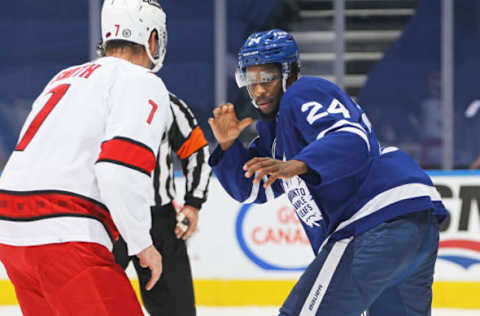 TORONTO, ON – FEBRUARY 7: Brendan Smith #7 of the Carolina Hurricanes engages Wayne Simmonds #24 of the Toronto Maple Leafs in a fight during an NHL game at Scotiabank Arena on February 7, 2022, in Toronto, Ontario, Canada. The Maple Leafs defeated the Hurricanes 4-3 in overtime. (Photo by Claus Andersen/Getty Images)