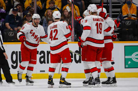 NASHVILLE, TENNESSEE – MAY 23: Vincent Trocheck #16, Maxime Lajoie #42, and Dougie Hamilton #19 of the Carolina Hurricanes celebrate a goal against the Nashville Predators during the first period in Game Four of the First Round of the 2021 Stanley Cup Playoffs at Bridgestone Arena on May 23, 2021, in Nashville, Tennessee. (Photo by Frederick Breedon/Getty Images)