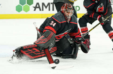 RALEIGH, NC – JANUARY 31: Carolina Hurricanes Goalie Petr Mrazek (34) slaps the puck clear of the net with his stick during a game between the Carolina Hurricanes and the Las Vegas Golden Knights on January 31, 2020 at the PNC Arena in Raleigh, NC. (Photo by Greg Thompson/Icon Sportswire via Getty Images)