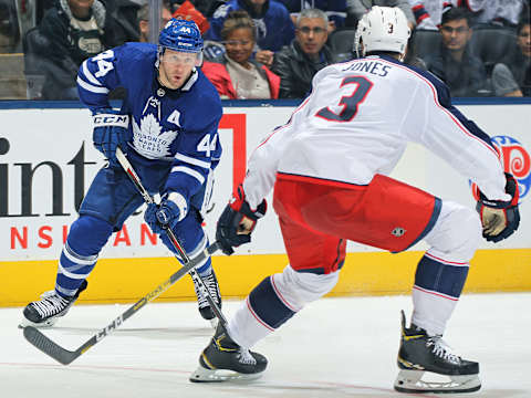 TORONTO, ON – OCTOBER 21: Morgan Rielly #44 of the Toronto Maple Leafs looks to make a play against Seth Jones #3 of the Columbus Blue Jackets. (Photo by Claus Andersen/Getty Images)