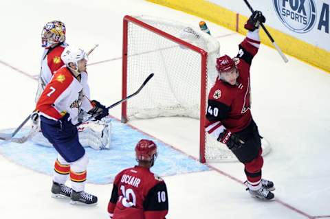 Mar 5, 2016; Glendale, AZ, USA; Arizona Coyotes left wing Alex Tanguay (40) celebrates with left wing Anthony Duclair (10) after scoring a goal as Florida Panthers defenseman Dmitry Kulikov (7) and goalie Al Montoya (35) react during the third period at Gila River Arena. Mandatory Credit: Matt Kartozian-USA TODAY Sports