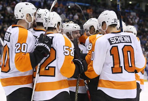 Feb 20, 2016; Toronto, Ontario, CAN; Philadelphia Flyers defenseman Shayne Gostisbehere (53) is congratulated by right wing Jakub Voracek (93) after scoring the game winning goal in overtime against the Toronto Maple Leafs at Air Canada Centre. Mandatory Credit: Tom Szczerbowski-USA TODAY Sports