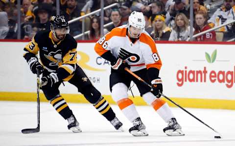 Apr 2, 2023; Pittsburgh, Pennsylvania, USA; Philadelphia Flyers left wing Joel Farabee (86) skates with the puck against Pittsburgh Penguins defenseman Pierre-Olivier Joseph (73) during the third period at PPG Paints Arena. The Penguins won 4-2. Mandatory Credit: Charles LeClaire-USA TODAY Sports