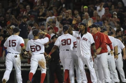 Sep 18, 2016; Boston, MA, USA; Boston Red Sox first baseman Hanley Ramirez (13) gets ready to high five right fielder Mookie Betts (50) after defeating the New York Yankees at Fenway Park. Mandatory Credit: Bob DeChiara-USA TODAY Sports