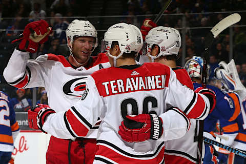 NEW YORK, NY – NOVEMBER 16: Sebastian Aho #20 of the Carolina Hurricanes celebrates his second period goal against the New York Islanders with teammates Teuvo Teravainen #86 and Jordan Staal #11 at Barclays Center on November 16, 2017 in New York City. (Photo by Mike Stobe/NHLI via Getty Images)