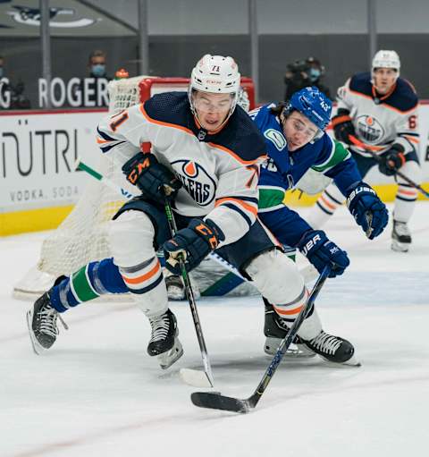 May 3, 2021; Vancouver, British Columbia, CAN; Vancouver Canucks defenseman Quinn Hughes (43) checks Edmonton Oilers forward Ryan McLeod (71) in the third period at Rogers Arena. Oilers won 5-3. Mandatory Credit: Bob Frid-USA TODAY Sports