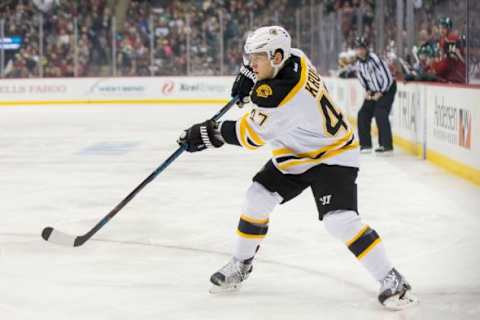 Feb 13, 2016; Saint Paul, MN, USA; Boston Bruins defenseman Torey Krug (47) shoots in the first period against the Minnesota Wild at Xcel Energy Center. Mandatory Credit: Brad Rempel-USA TODAY Sports