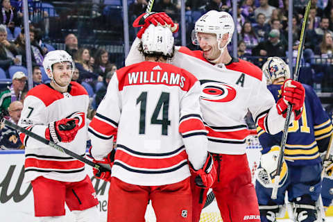 BUFFALO, NY – NOVEMBER 18: Hurricanes teammates congratulate Carolina Hurricanes Right Wing Justin Williams (14) after he scores goal during the Carolina Hurricanes and Buffalo Sabres NHL game on November 18, 2017, at KeyBank Center in Buffalo, NY. (Photo by John Crouch/Icon Sportswire via Getty Images)