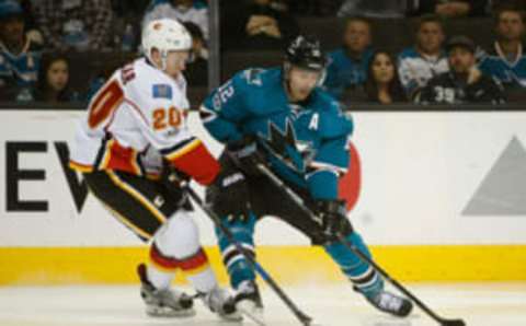 San Jose Sharks left wing Patrick Marleau (12) controls the puck against Calgary Flames center Curtis Lazar (20) (Stan Szeto-USA TODAY Sports)