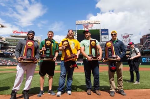 Jun 4, 2016; Minneapolis, MN, USA; Members of the North Dakota State University football team show off their national championship rings and trophies before the game between the Minnesota Twins and Tampa Bay Rays at Target Field. Mandatory Credit: Brad Rempel-USA TODAY Sports