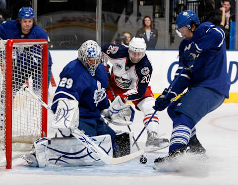 TORONTO – FEBRUARY 19: Justin Pogge #29 and Luke Schenn #2 of the Toronto Maple Leafs tries to stop Kristian Huselius #20 of the Columbus Blue Jackets during game action February 19, 2009 at the Air Canada Centre in Toronto, Ontario, Canada. (Photo by Dave Abel/Getty Images)