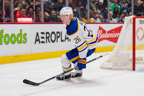 Mar 20, 2022; Vancouver, British Columbia, CAN; Buffalo Sabres defenseman Rasmus Dahlin (26) celebrates his game winning goal against the Vancouver Canucks at Rogers Arena. Sabres won 3-2 in overtime. Mandatory Credit: Bob Frid-USA TODAY Sports