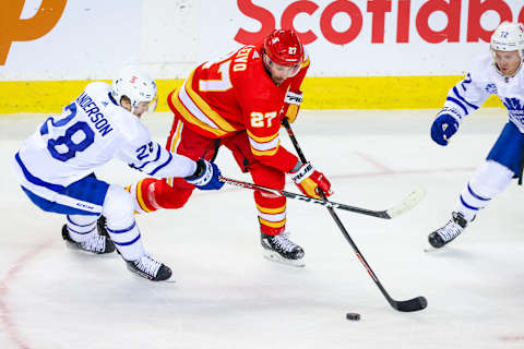 Jan 26, 2021; Calgary, Alberta, CAN; Calgary Flames left wing Josh Leivo (27) and Toronto Maple Leafs  Mandatory Credit: Sergei Belski-USA TODAY Sports