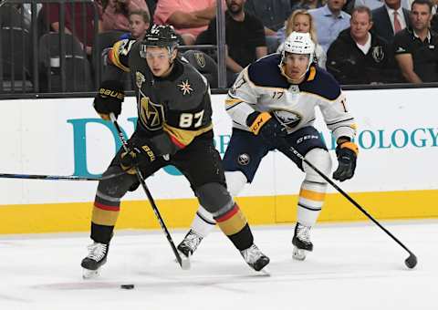 Vadim Shipachyov of the Vegas Golden Knights skates with the puck ahead of Jordan Nolan of the Buffalo Sabres in the second period of their game at T-Mobile Arena on October 17, 2017.