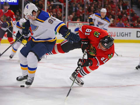 Apr 17, 2016; Chicago, IL, USA; St. Louis Blues right wing Vladimir Tarasenko (91) and Chicago Blackhawks right wing Marian Hossa (81) fight for the puck during the first period in game three of the first round of the 2016 Stanley Cup Playoffs at the United Center. Mandatory Credit: Dennis Wierzbicki-USA TODAY Sports