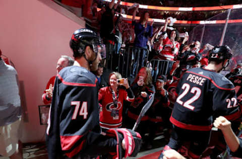 RALEIGH, NC – MAY 03: Jaccob Slavin #74 and teammate Brett Pesce #22 of the Carolina Hurricanes enter the ice during intoductions prior to Game Four of the Eastern Conference Second Round aainst the New York Islanders during the 2019 NHL Stanley Cup Playoffs on May 3, 2019 at PNC Arena in Raleigh, North Carolina. (Photo by Gregg Forwerck/NHLI via Getty Images)