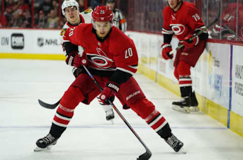 RALEIGH, NC – NOVEMBER 12: Carolina Hurricanes Center Sebastian Aho (20) skates a puck into the zone during a game between the Chicago Blackhawks and the Carolina Hurricanes at the PNC Arena in Raleigh, NC on November 12, 2018. (Photo by Greg Thompson/Icon Sportswire via Getty Images)