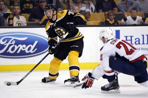 Sep 22, 2015; Boston, MA, USA; Boston Bruins right wing Zach Senyshyn (71) takes a shot on goal while defended by Washington Capitals defenseman Ryan Stanton (20) during the third period at TD Garden. The Boston Bruins won 2-1 in overtime. Mandatory Credit: Greg M. Cooper-USA TODAY Sports