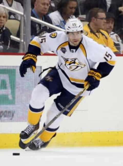 Mar 31, 2016; Pittsburgh, PA, USA; Nashville Predators center Craig Smith (15) skates up ice with the puck against the Pittsburgh Penguins during the third period at the CONSOL Energy Center. The Penguins won 5-2. Mandatory Credit: Charles LeClaire-USA TODAY Sports