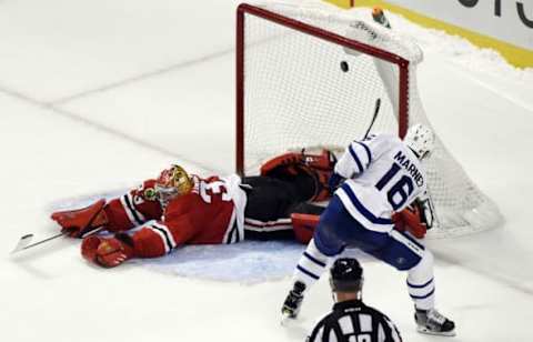 Oct 22, 2016; Chicago, IL, USA; Chicago Blackhawks goalie Scott Darling (33) blocks a shot by Toronto Maple Leafs center Mitchell Marner (16) during a shootout at the United Center. The Chicago Blackhawks beat the Toronto Maple Leafs 5-4. Mandatory Credit: Matt Marton-USA TODAY Sports