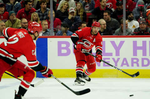 RALEIGH, NC – NOVEMBER 21: Jordan Martinook #48 of the Carolina Hurricanes passes the puck to teammate Brett Pesce #22 during an NHL game against the Philadelphia Flyers on November 21, 2019 at PNC Arena in Raleigh, North Carolina. (Photo by Gregg Forwerck/NHLI via Getty Images)