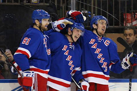 NEW YORK, NY – JANUARY 19: J.T. Miller #10 (c) of the New York Rangers celebrates his overtime game winning goal against the Vancouver Canucks along with Rick Nash #61 (l) and Ryan McDonagh #27 (r) at Madison Square Garden on January 19, 2016 in New York City. The Rangers defeated the Canucks 3-2 in overtime. (Photo by Bruce Bennett/Getty Images)