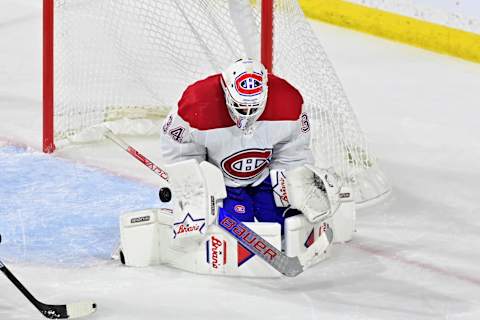 Nov 2, 2023; Tempe, Arizona, USA; Montreal Canadiens goaltender Jake Allen (34) makes a save in the third period against the Arizona Coyotes at Mullett Arena. Mandatory Credit: Matt Kartozian-USA TODAY Sports