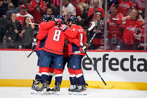 WASHINGTON, DC – NOVEMBER 01: T.J. Oshie #77 of the Washington Capitals celebrates with his teammates after scoring a goal in the third period against the Buffalo Sabres at Capital One Arena on November 1, 2019 in Washington, DC. (Photo by Patrick McDermott/NHLI via Getty Images)