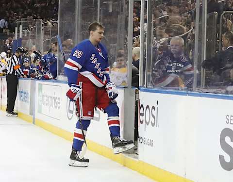 NEW YORK, NEW YORK – DECEMBER 16: Pavel Buchnevich #89 of the New York Rangers leaves the ice following a hit from Ryan Ellis #4 of the Nashville Predators during the second period at Madison Square Garden on December 16, 2019 in New York City. (Photo by Bruce Bennett/Getty Images)