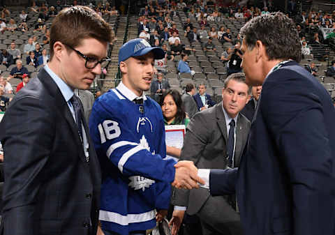 DALLAS, TX – JUNE 23: Sean Durzi greets his team after being selected 52nd overall by the Toronto Maple Leafs during the 2018 NHL Draft at American Airlines Center on June 23, 2018 in Dallas, Texas. (Photo by Brian Babineau/NHLI via Getty Images)