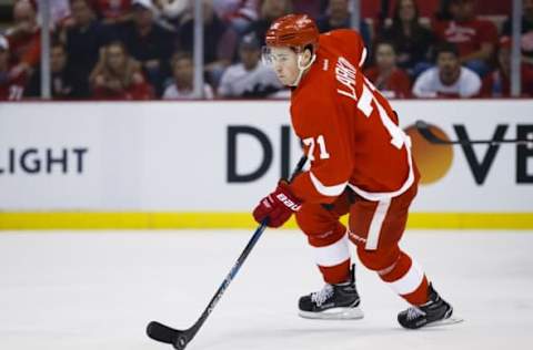 Apr 17, 2016; Detroit, MI, USA; Detroit Red Wings center Dylan Larkin (71) skates with the puck during the first period in game three of the first round of the 2016 Stanley Cup Playoffs at Joe Louis Arena. Mandatory Credit: Rick Osentoski-USA TODAY Sports