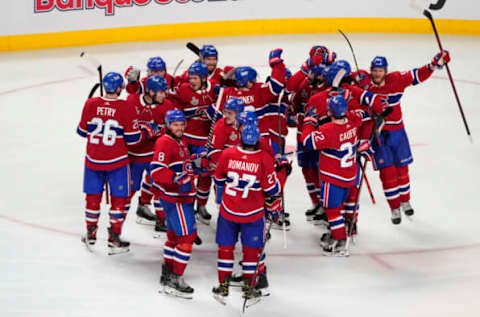 MONTREAL, QUEBEC – JULY 05: The Montreal Canadiens celebrate their 3-2 win during the first overtime period against the Tampa Bay Lightning in Game Four of the 2021 NHL Stanley Cup Final at the Bell Centre on July 05, 2021 in Montreal, Quebec, Canada. (Photo by Mark Blinch/Getty Images)