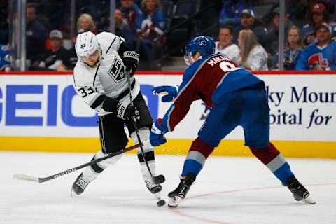 DENVER, CO – APRIL 13: Viktor Arvidsson #33 of the Los Angeles Kings shoots the puck as Cale Makar #8 of the Colorado Avalanche defends during the third period at Ball Arena on April 13, 2022, in Denver, Colorado. (Photo by Justin Edmonds/Getty Images)